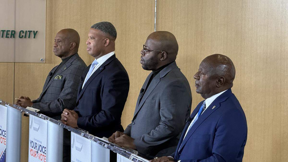Sheriff Garry McFadden, former Chief Deputy Rodney Collins, former Detention Officer Antwain Nance and Charlotte-Mecklenburg Police Sgt. Ricky Robbins before a debate on Wednesday evening. They talked Jail North, Immigration and Customs Enforcement and leadership.