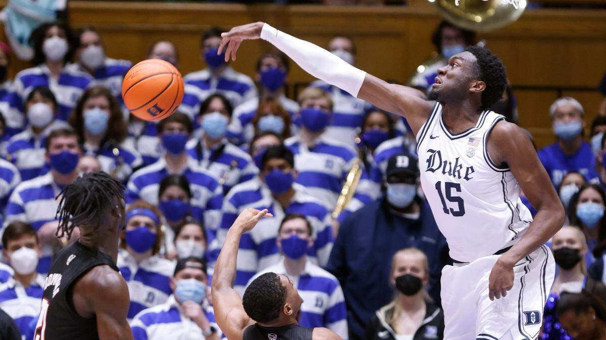 Duke’s Mark Williams (15) blocks the shot by N.C. State’s Casey Morsell (14) during the second half of Duke’s 88-73 victory over N.C. State at Cameron Indoor Stadium in Durham, N.C., Saturday, January 15, 2022.
