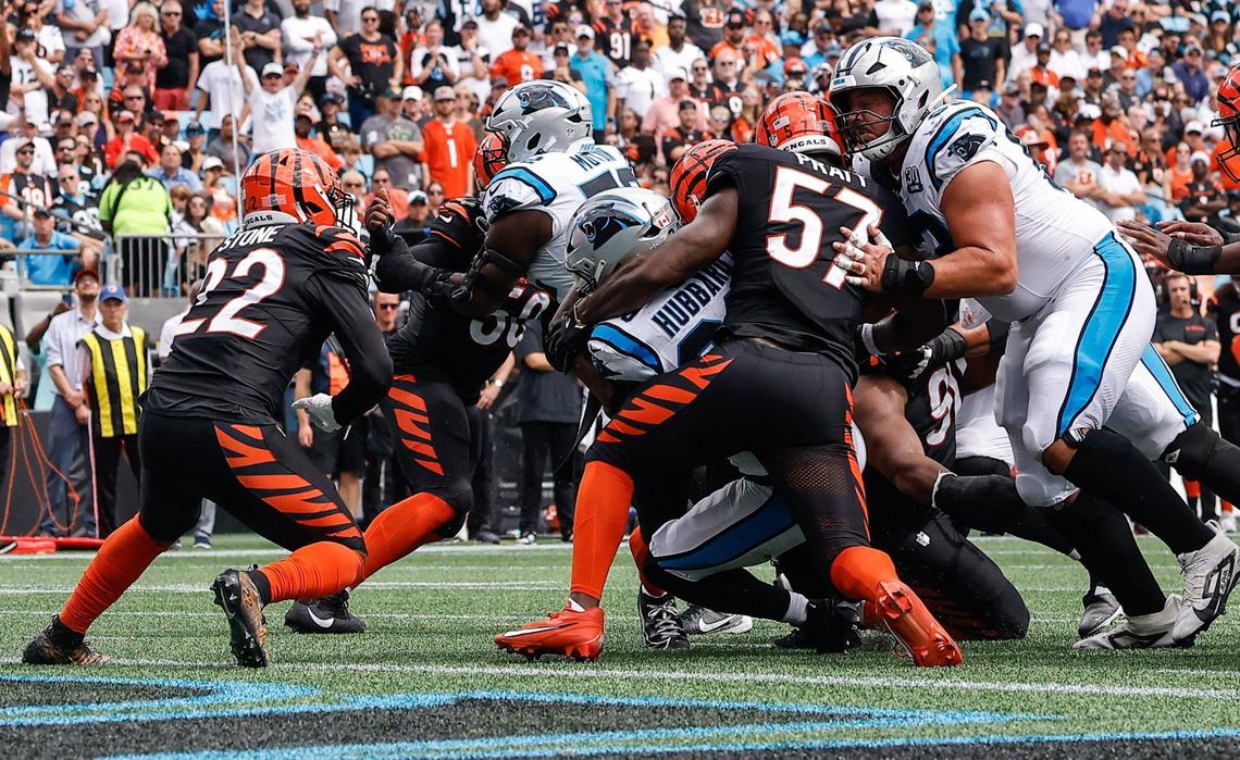 Panthers runningback Chuba Hubbard, center, pushes through the Bengals’ defense to enter the end zone during the game at Bank of America stadium in Charlotte, NC on Sunday, September 29, 2024.