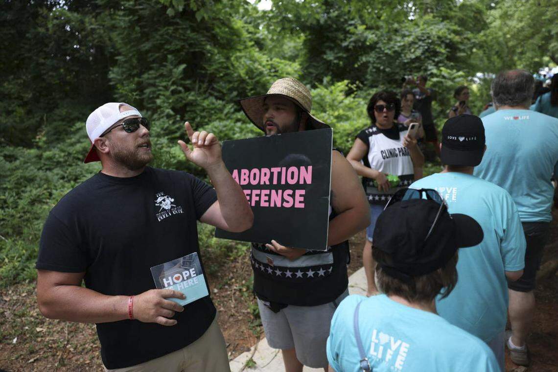 Anti-abortion activists gather at A Preferred Women’s Health Center of Charlotte on Saturday.