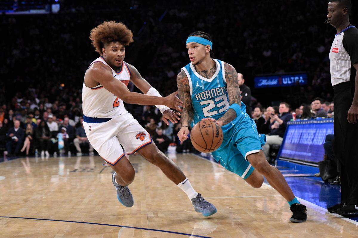 Charlotte Hornets guard Tre Mann (23) drives to the basket while being defended by New York Knicks guard Miles McBride (2) during the second half earlier this month at Madison Square Garden. John Jones-Imagn Images