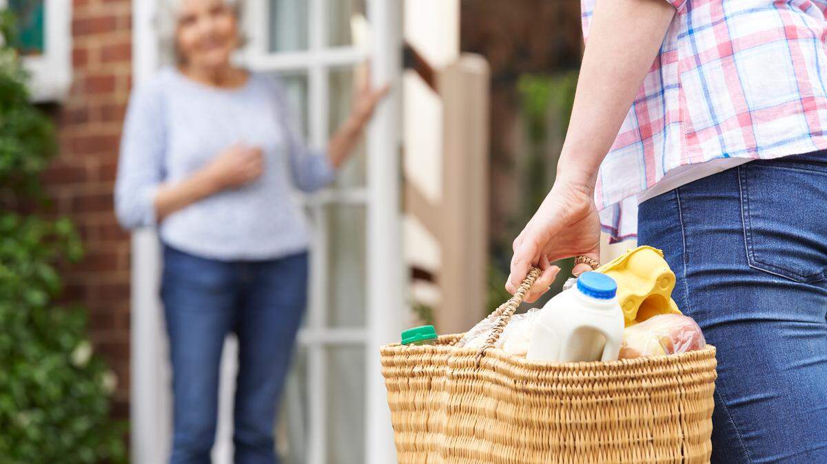 Person Doing Shopping For Elderly Neighbour