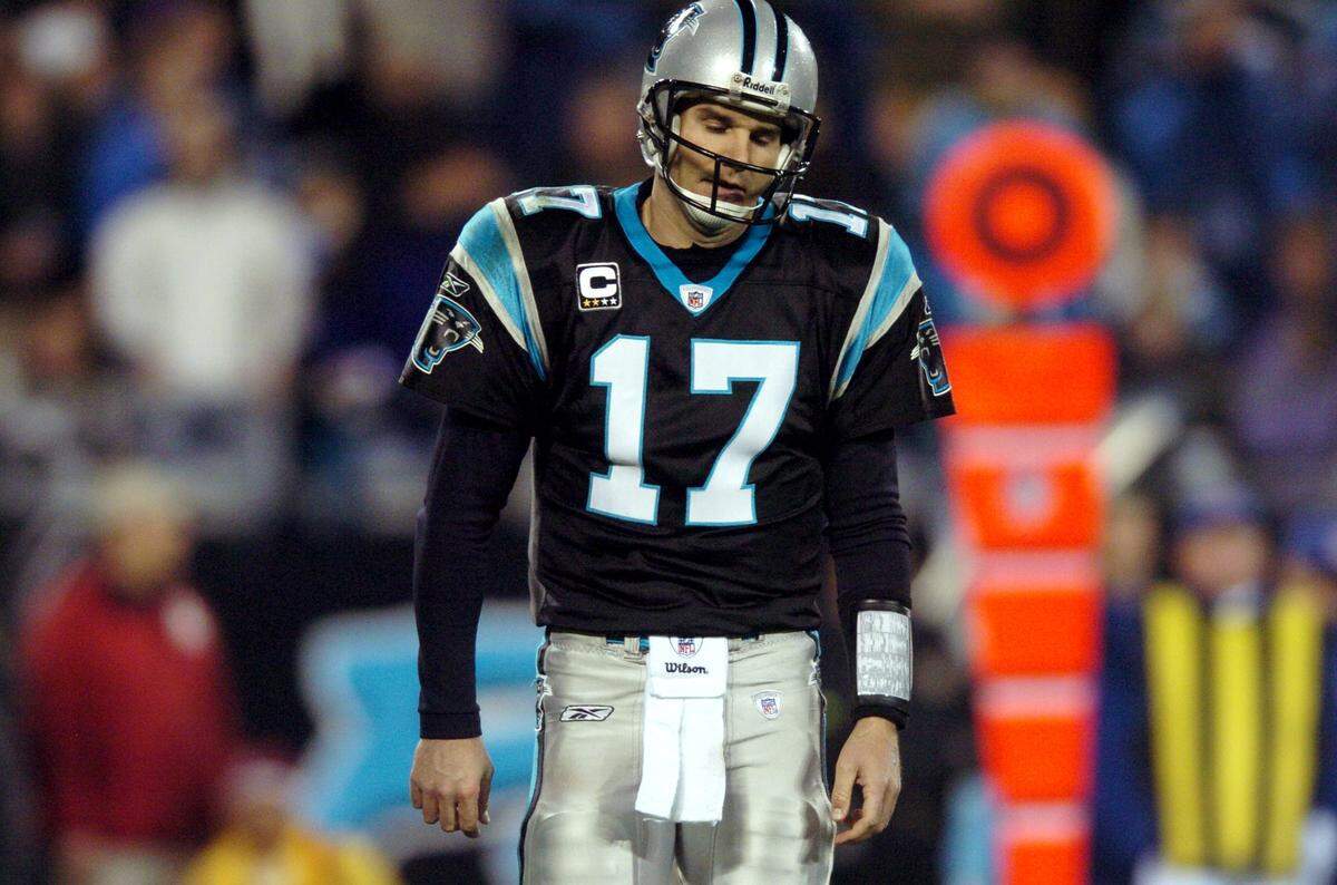 Jake Delhomme walks off the field after throwing an interception against the Arizona Cardinals at Bank of America Stadium on Jan. 10, 2009. The Panthers were defeated by the Cardinals 33-13, and Delhomme had six turnovers.
