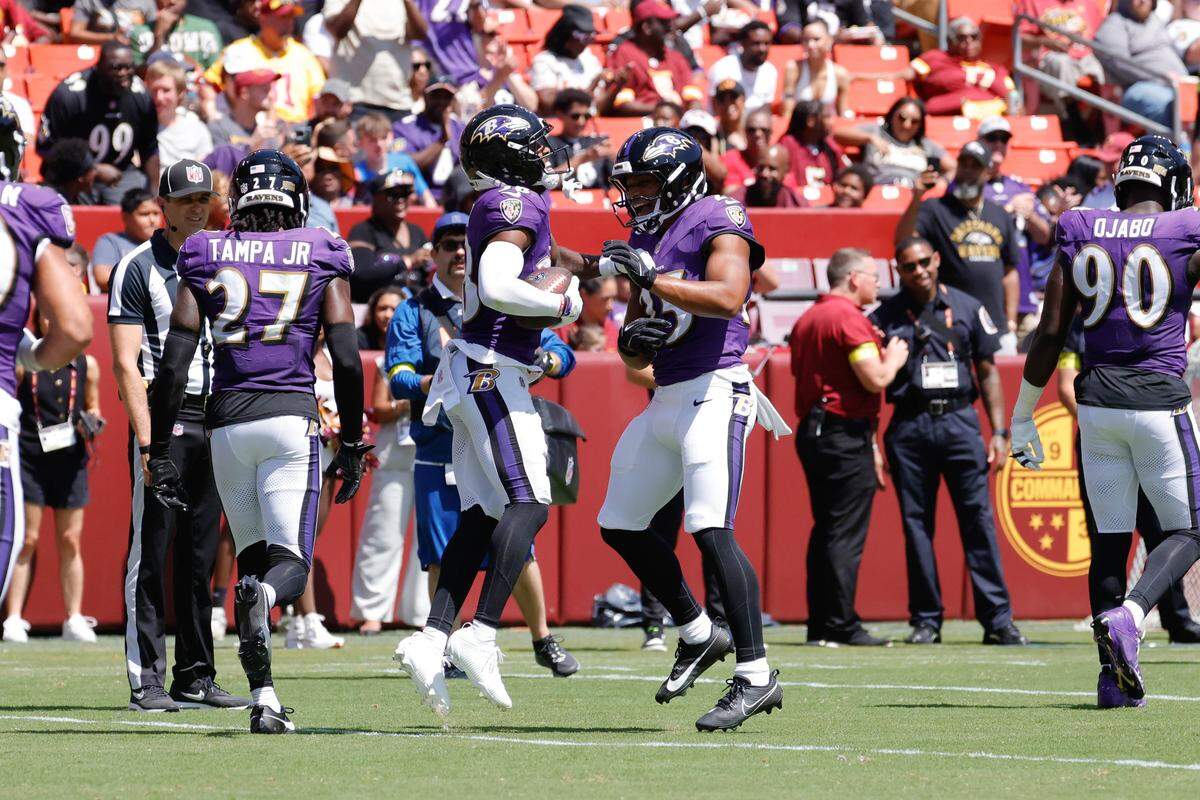 Baltimore Ravens running back Myles Gaskin (38) and safety Beau Brade (25) celebrate after scoring a touchdown in the second quarter against the Washington Commanders earlier this month. 