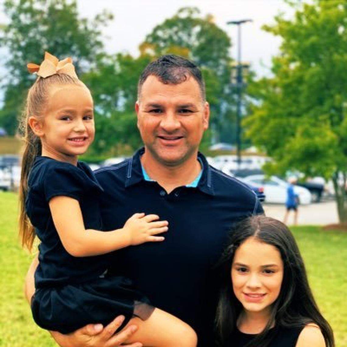 New Charlotte Christian football coach Jammie Deese with his daughter