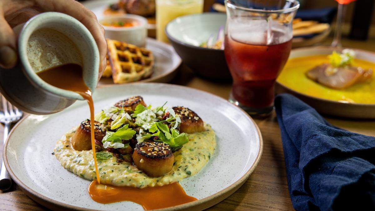 Chef and owner Sam Diminich of Restaurant Constance and chef and owner Andres Kaifer of Customshop are coming together for a Savor Charlotte collaboration dinner that will include Diminich’s scallop switch sweet potato spaetzle, with brie and black truffle.