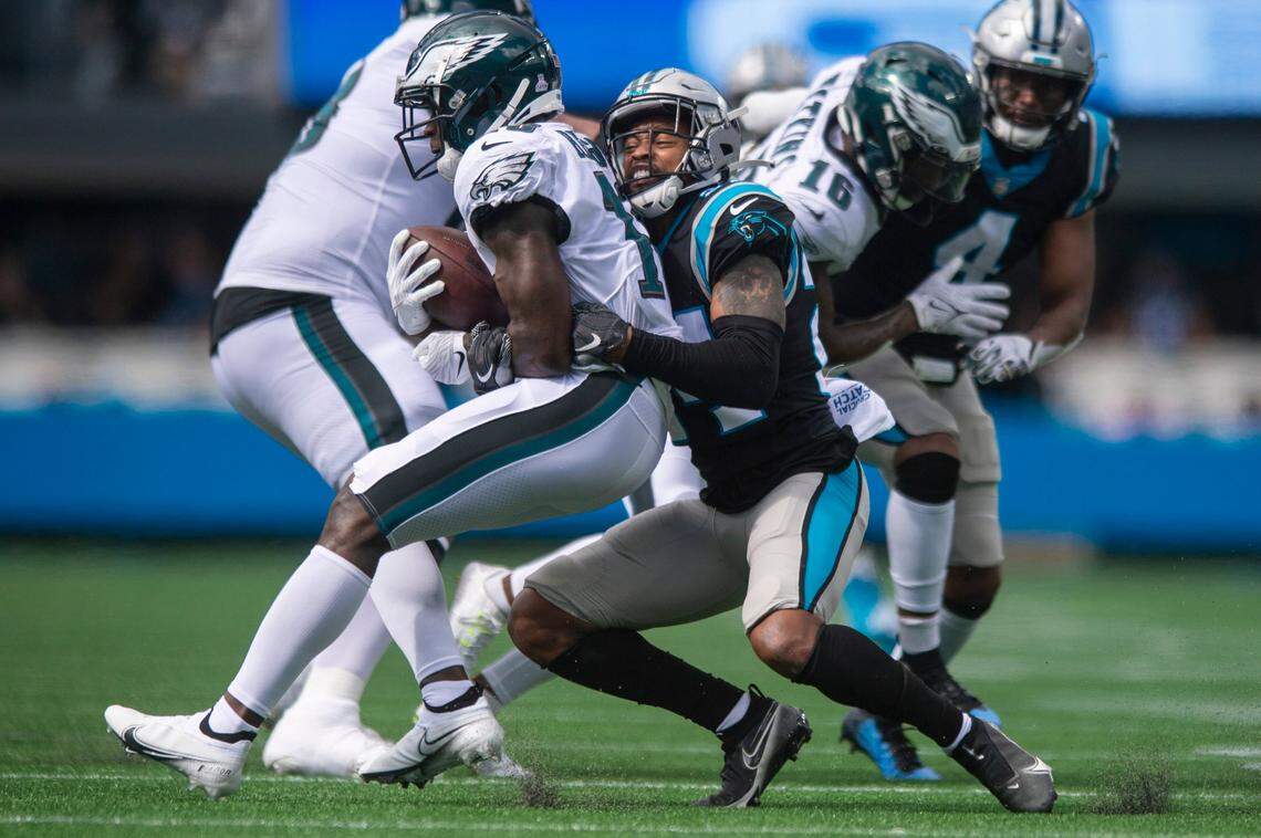 Panthers cornerback A.J. Bouye, right, grabs onto Eagles wide receiver Jalen Reagor during the game at Bank of America Stadium on Sunday, October 10, 2021 in Charlotte, NC.