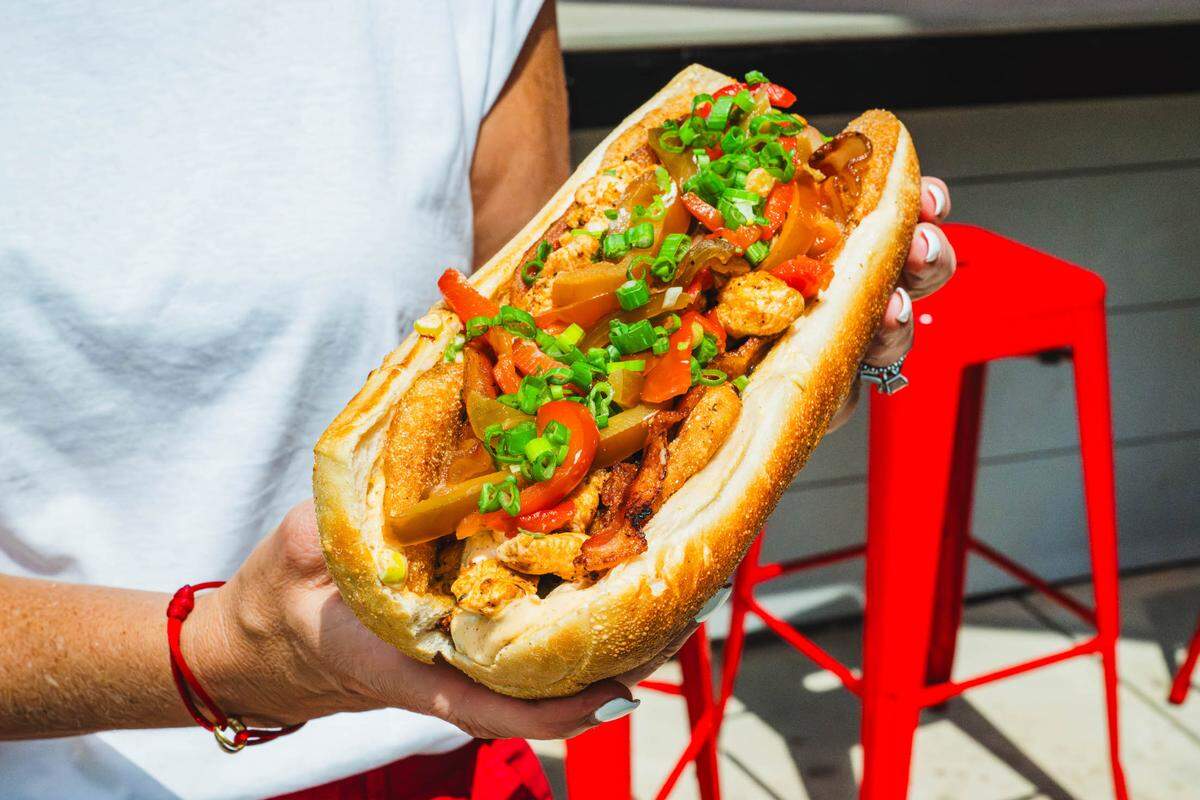 Cheat’s Cheesesteaks’ entry in the Duke’s Hot Tomato Summer competition is the Cheat’s Fried Green Tomato Club with honey Sriracha glazed Bacon and Springer Mountain Farms chicken.