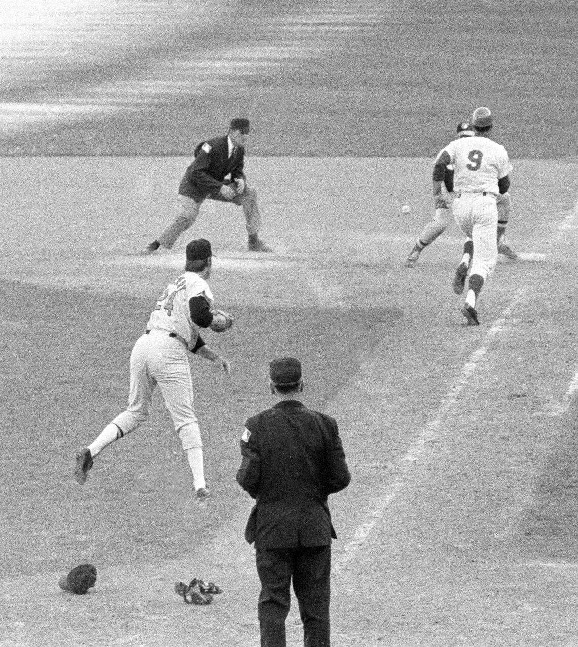 J.C Martin races for first as Pete Pichert’s throw bounds away in the tenth inning of the fourth World Series game in New York’s Shea Stadium, Oct. 15, 1969. Mets won as Rod Gaspar scored from second. (AP Photo)