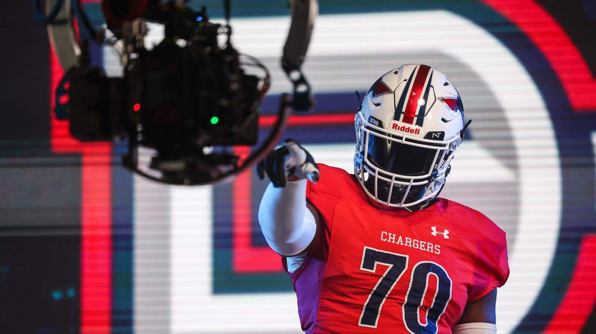 Providence Day offensive tackle David Sanders works the camera for media day on Wednesday, June 14, 2023 at Bank of America Stadium. The two schools will face each other for a game on Saturday, August 19th at Bank of America Stadium.