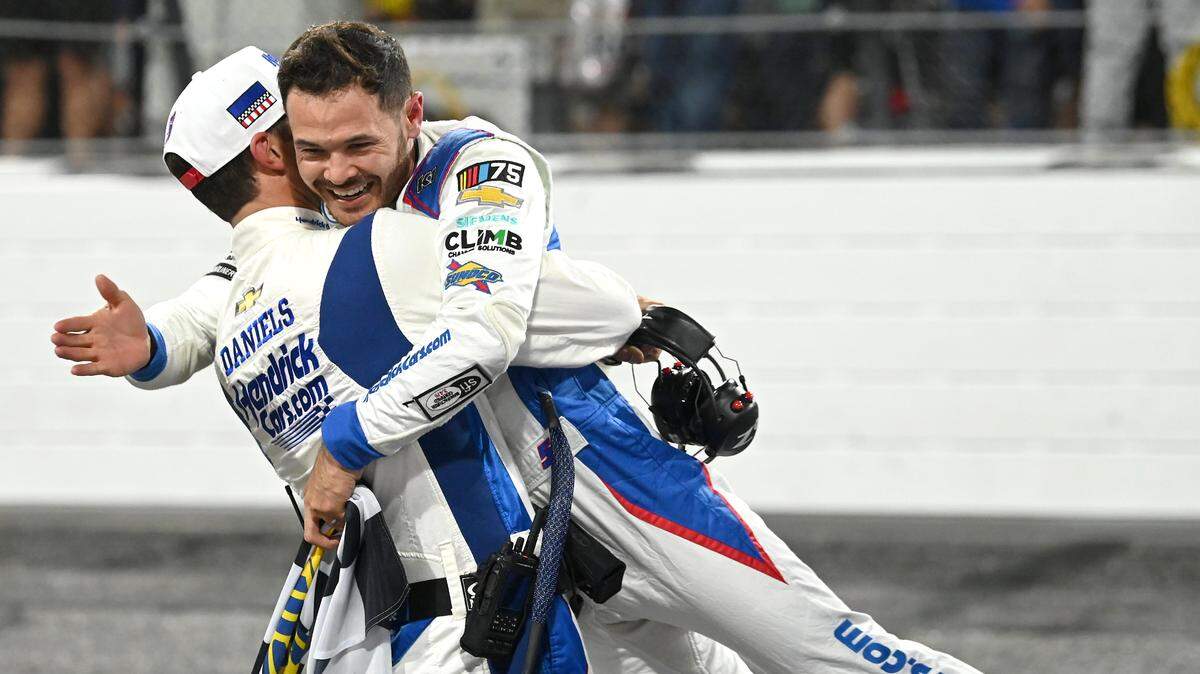 NASCAR crew chief Cliff Daniels, left, lifts driver Kyle Larson into the air as they celebrate winning the NASCAR All-Star race at North Wilkesboro Speedway on Sunday, May 21, 2023.