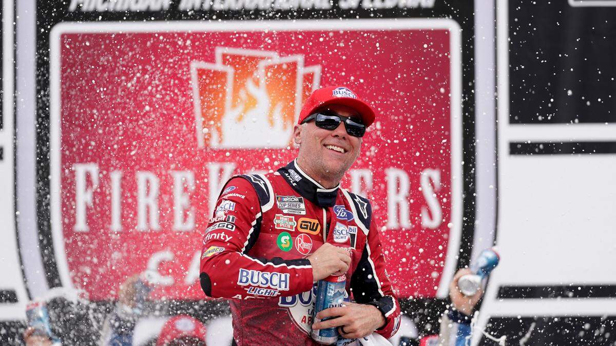 Kevin Harvick celebrates after winning the NASCAR Cup Series auto race at the Michigan International Speedway in Brooklyn, Mich., Sunday, Aug. 7, 2022. (AP Photo/Paul Sancya)