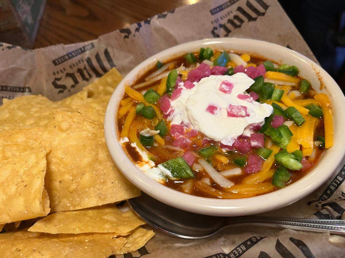 Mac’s Speed Shop’s beef and black bean chili, topped with “the whole shebang.”