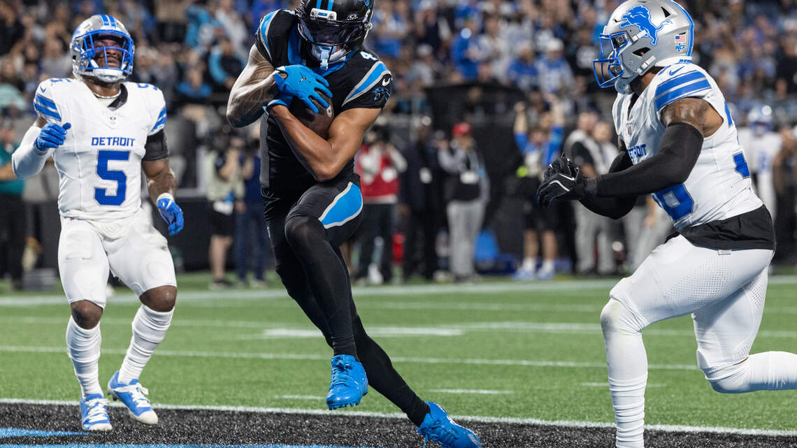 PHOTOS: Panthers win, 32-26, over the Lions