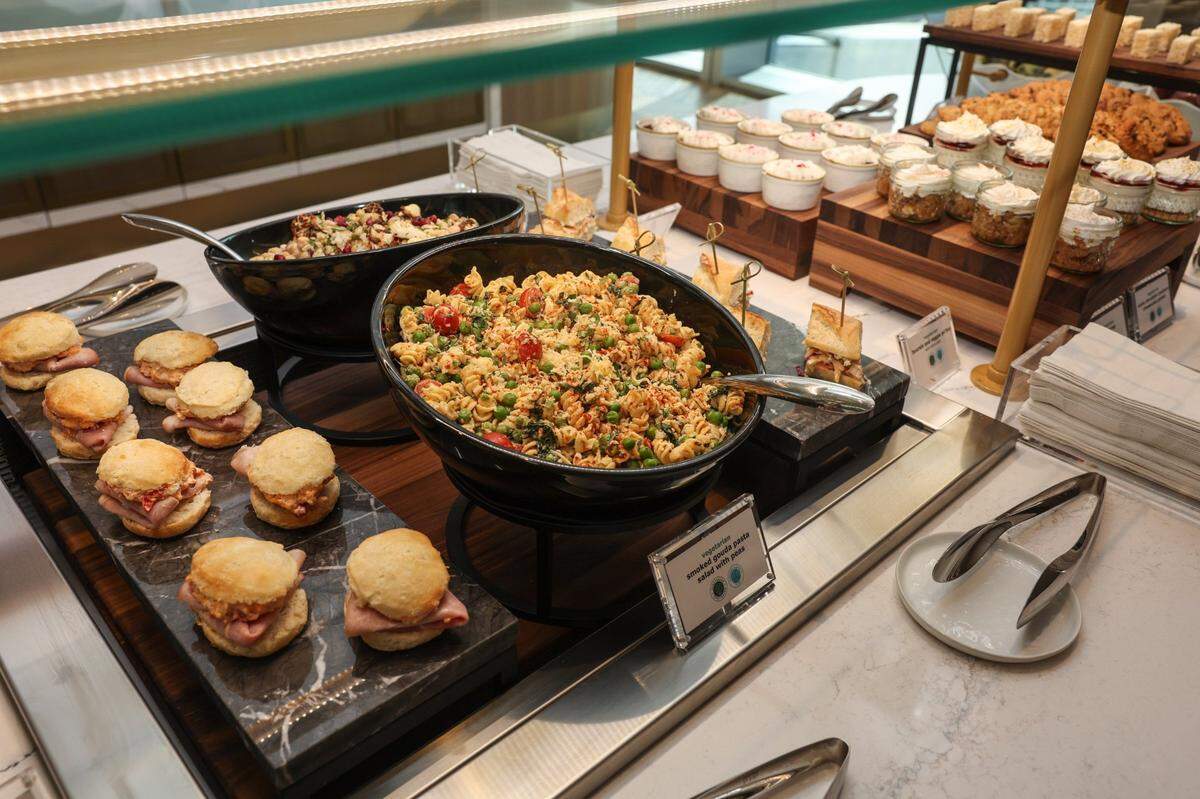 Food in the buffet inside the Delta Sky Club in Charlotte gives a nod to Southern cuisine with items such as ham biscuits with pimento cheese and Po-boy bites.
