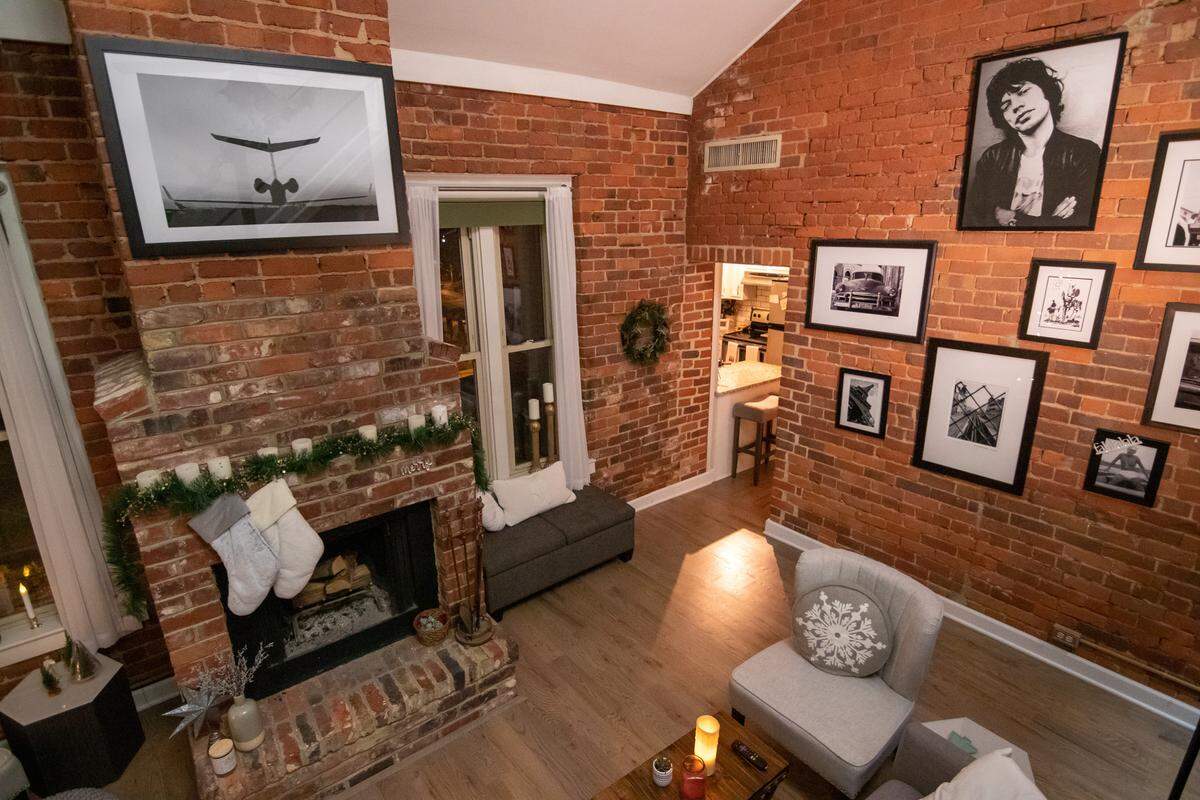 Inside of St. Peter’s Condominiums, the Reinsmith Residence features simple holiday decor and photos taken by homeowner Kory Reinsmith.