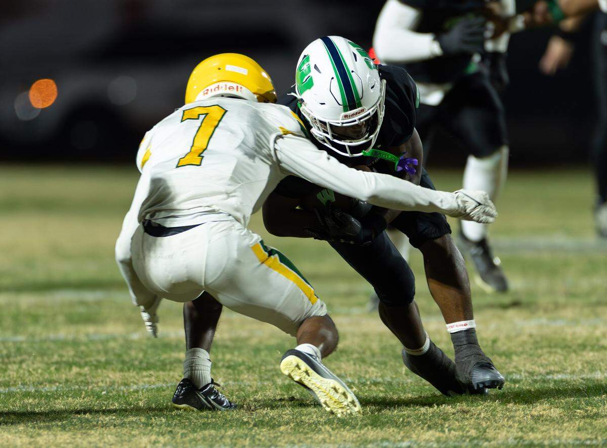 Weddington's Kelson Tate (right) breaks into the open field and is tackled by Independence defensive back Jon Snipes (left). Weddington would host Independence in the NCHSAA quarterfinal playoff game Friday, November, 28 2025.
