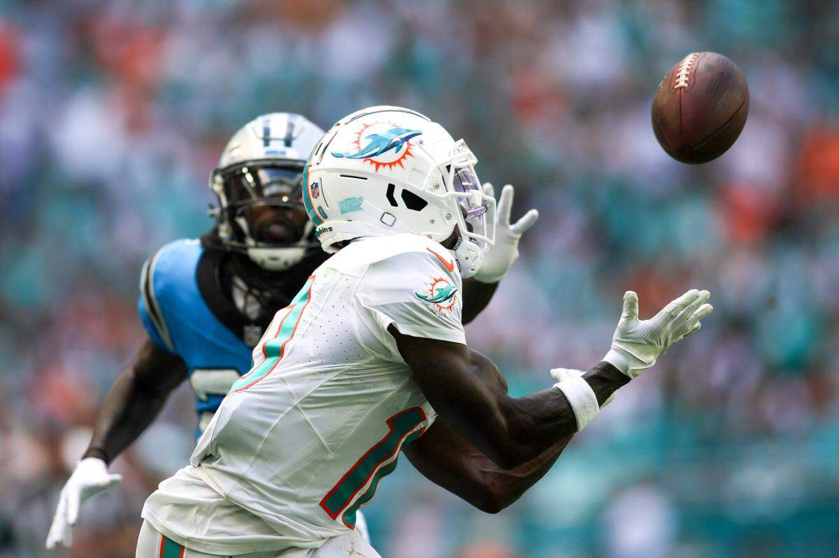 Oct 15, 2023; Miami Gardens, Florida, USA; Miami Dolphins wide receiver Tyreek Hill (10) catches the football for a touchdown against Carolina Panthers during the second quarter at Hard Rock Stadium. Mandatory Credit: Sam Navarro-USA TODAY Sports