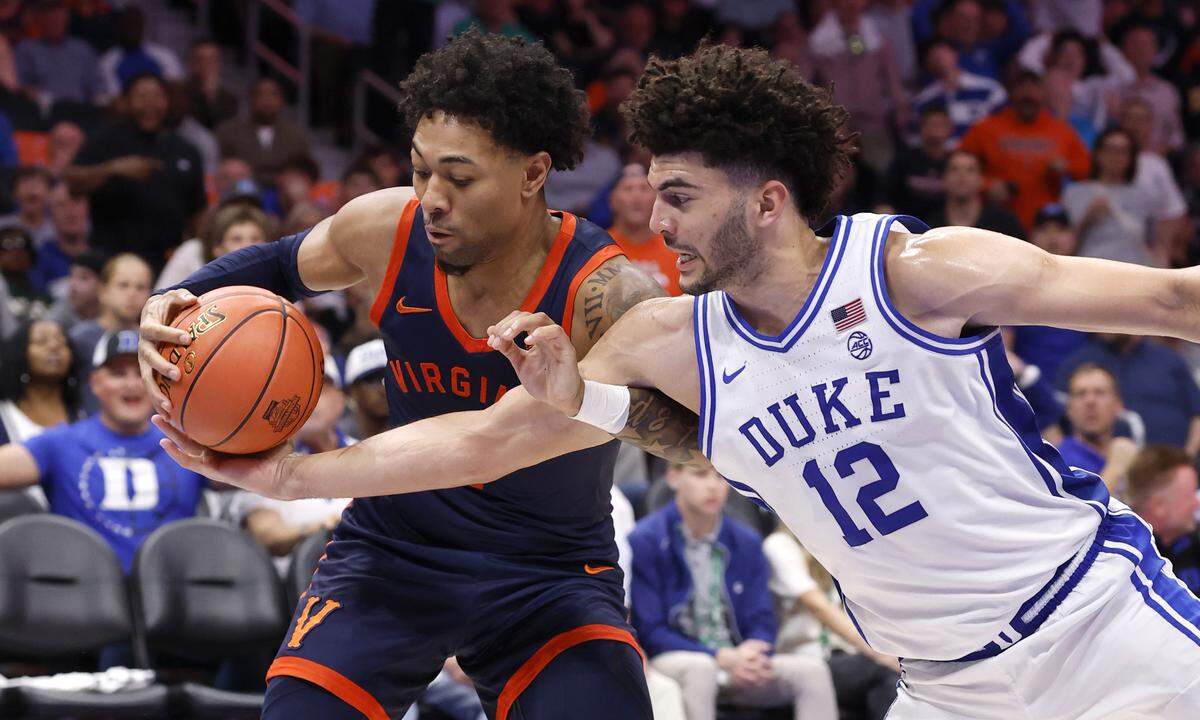 Virginia's Malik Thomas (1) and Duke’s Cameron Boozer (12) fight for the ball Saturday.