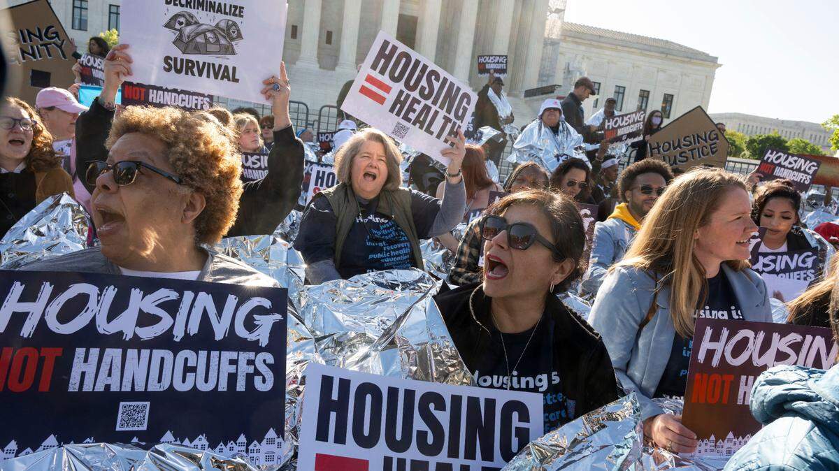 Homeless advocates take part in the “Housing Not Handcuffs” rally organized by the National Homelessness Law Center during Johnson v Grants Pass oral arguments at the U.S. Supreme Court on Monday, April 22, 2024 in Washington.