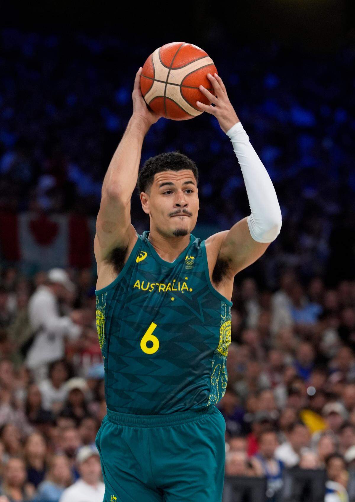 Josh Green, playing for Australia, in action against Canada in a men’s group stage basketball match during the Paris 2024 Olympic Summer Games at Stade Pierre-Mauroy.