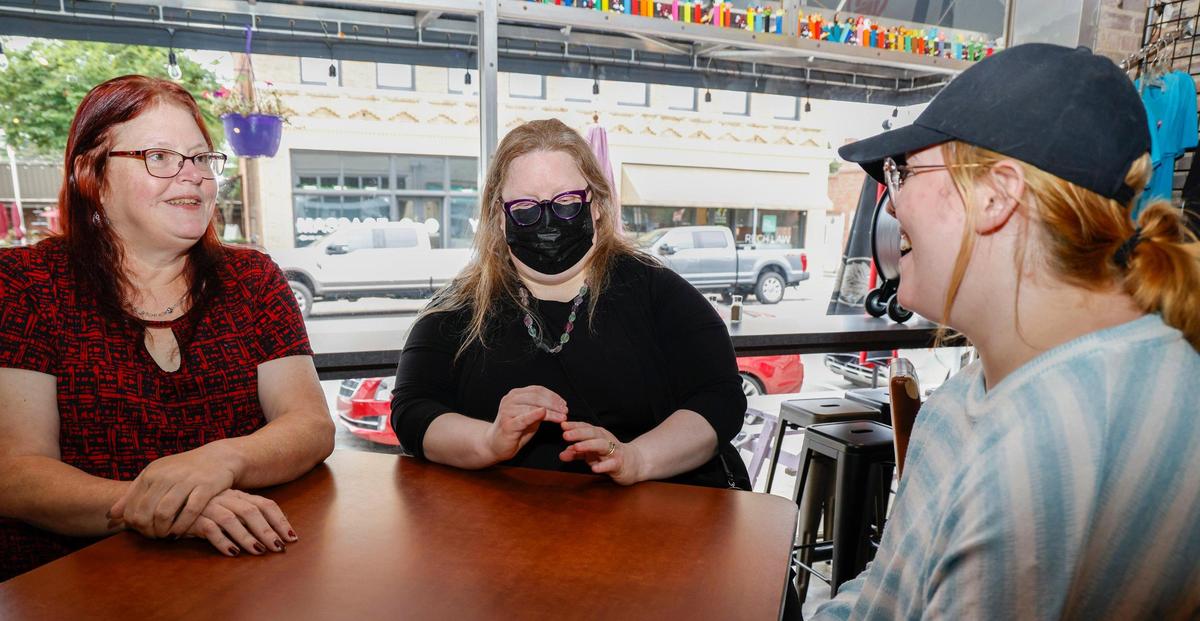 (L-R) Cynthia Brown, Cristal Robinson and Emily Allen talk at the East Frank Superette and Kitchen in Monroe, N.C., Thursday, Aug. 11, 2022.