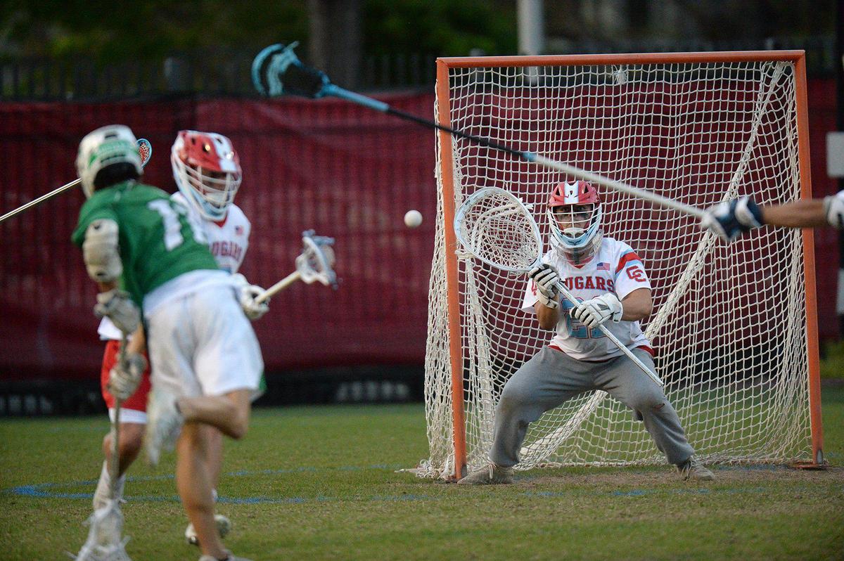 Myers Park’s #11, Max Forsyth scores a first half goal against Charlotte Catholic’s #21, Brady Kam. Charlotte Catholic, ranked #1 in North Carolina and #3 nationally put a perfect, 13-0 record, on the line against 6-3 Myers Park for a match of boys lacrosse teams. The teams were tied 9-9 after the first half. Catholic’s Jack Ransom, a Georgetown recruit, is a standout player. The teams battled on Monday, April 8, 2024.