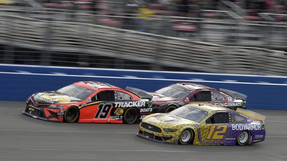 Martin Truex Jr. (19) leads Alex Bowman (88) and Ryan Blaney (12) on lap 130 of a NASCAR Cup Series auto race Sunday, March 1, 2020 in Fontana, Calif. (AP Photo/Will Lester)