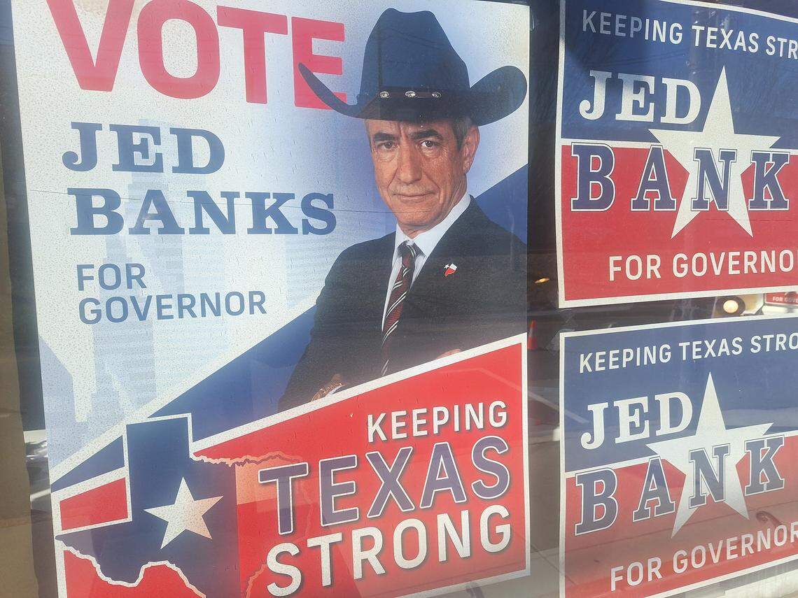 Vote Jed Banks campaign signs appeared in the windows of a building in downtown Mooresville on Tuesday.