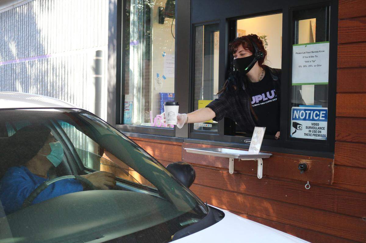 CupLux Coffee has implemented a system at its drive-thru with a tray stand so that there is no person-to-person contact during the food exchange in response to COVID-19.