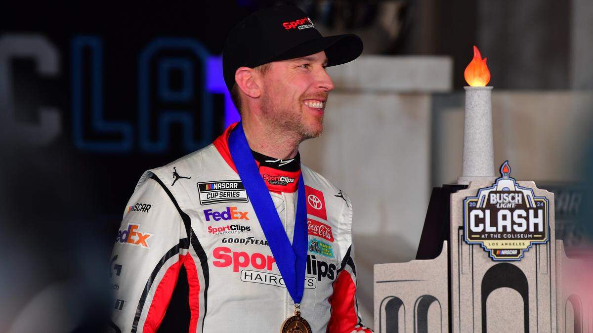 Feb 3, 2024; Los Angeles, California, USA; NASCAR Cup Series driver Denny Hamlin (11) celebrates his victory of the Busch Light Clash at Los Angeles Memorial Coliseum.