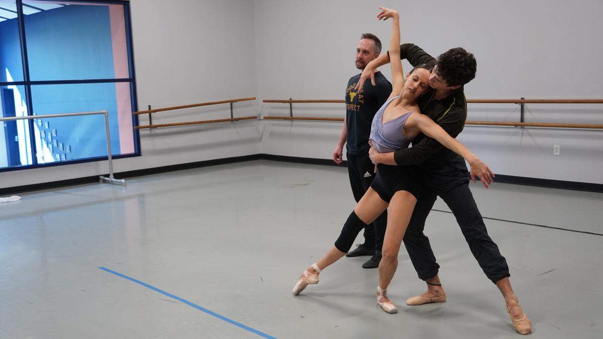 Choreographer Christopher Stuart, left, rehearses with Charlotte Ballet dancers Alessandra Ball James and Josh Hall.
