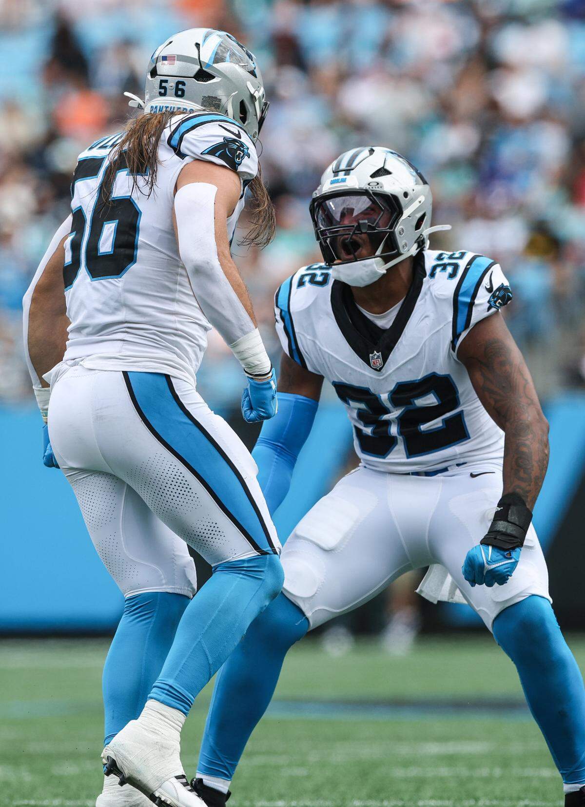 Panthers linebackers Christian Rozeboom and Trevin Wallace celebrate Rozeboom's tackle during the game against the Dolphins at Bank of America Stadium in Charlotte, NC on Sunday, October 5, 2025.