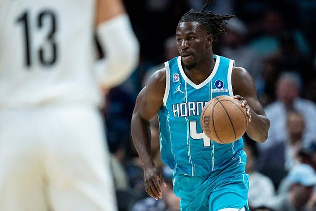 Sion James #4 of the Charlotte Hornets plays against the Brooklyn Nets during the game at Spectrum Center on October 22, 2025 in Charlotte, North Carolina.