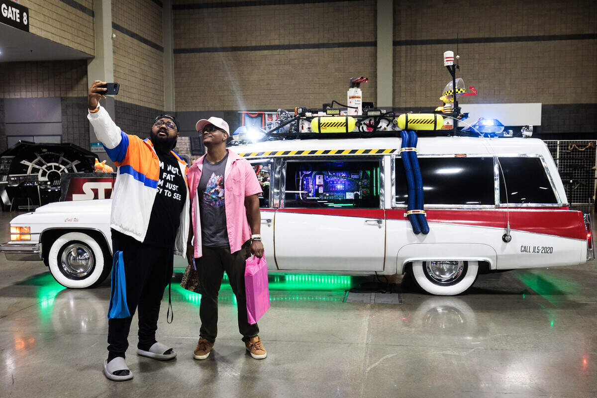 Devyn Ersery (left) and Michael Jones take a selfie in front of a Ghostbusters “Ecto-1” model car at Heroes Convention on Friday, June 12, 2026 at the Charlotte Convention Center. “Nerds don’t get to socialize as much because we’re all just playing video games,” Ersery said. “It’s (HeroesCon) just a good experience. This is like our club scene.”