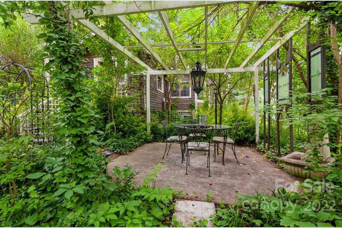 The late Gail Young Marshall placed multiple porticoes and chairs in her yard. She enjoyed seeing all the bees and hummingbirds on her wooded property.