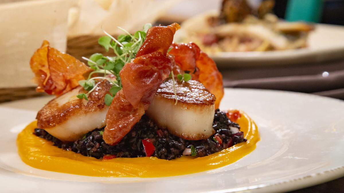 Aria Tuscan Grill is offering Pan-Roasted Nantucket Scallops with whipped butternut squash, forbidden rice and crispy prosciutto in November. 