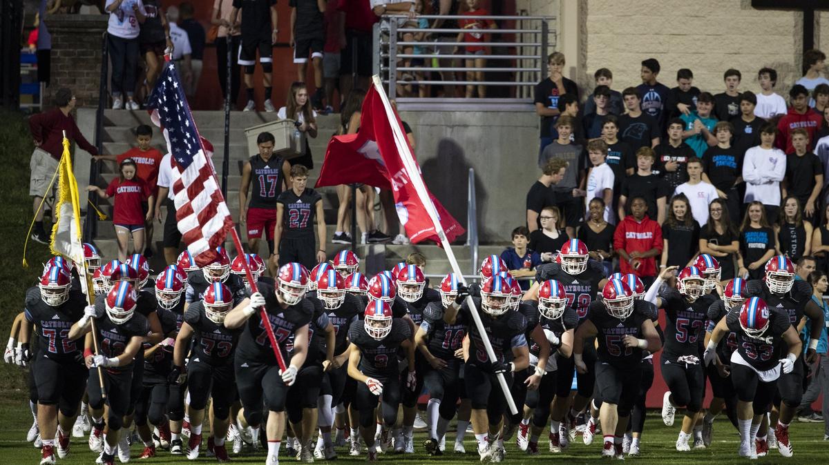 The Charlotte Catholic Cougars take the field to face the Weddington Warriors before a prep football game at Charlotte Catholic High School Friday, September 28, 2018 in Charlotte, NC. Photo by JASON E. MICZEK - Special to the Observer