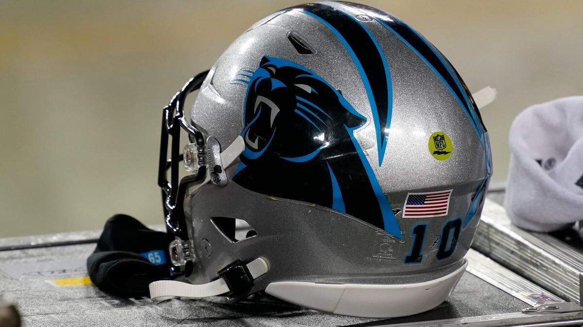 Carolina Panthers helmet sits on the bench during an NFL football game between the Carolina Panthers and the Washington Football Team, Sunday, Dec. 27, 2020, in Landover, Md. (AP Photo/Mark Tenally)
