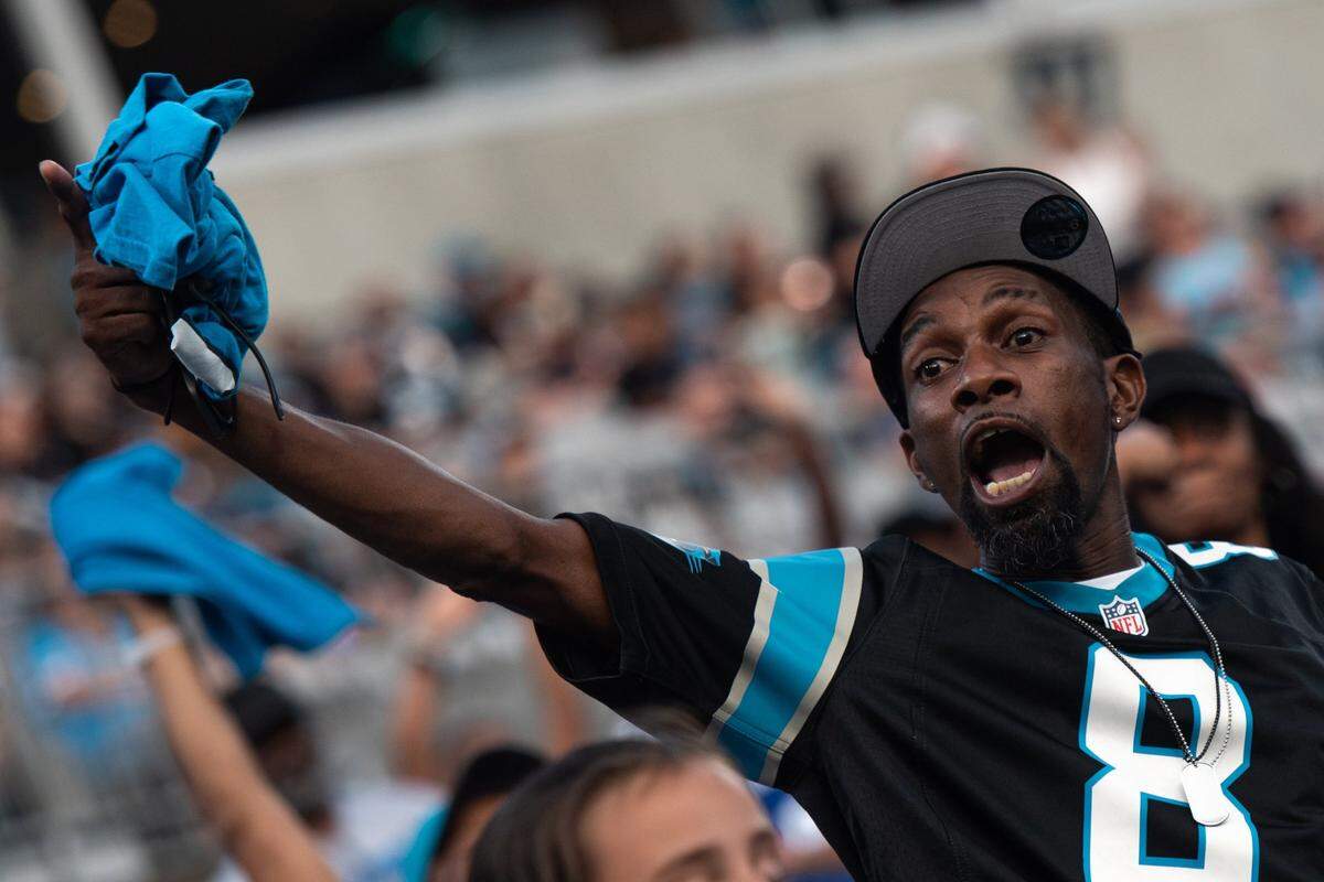 A Carolina Panthers fan shouts in the stands at Fan Fest at Bank of America Stadium on Thursday, Aug. 11, 2022 in Charlotte, N.C.