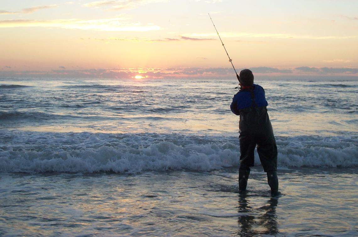    Surf fishing may be limited at Cape Hatteras and Cape Lookout national seashores this fall because of damage from Hurricane Isabel. Last November, at the Ocracoke Island part of the Cape Hatteras seashore, angler Judy Gasper of McKees Rocks, Pa., casts into the breakers at dawn.