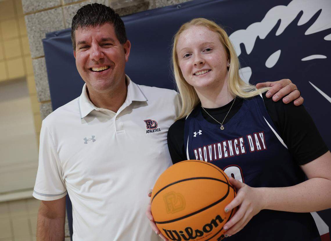 Ginny Ann Duman, a junior at Providence Day School, is shown with her coach Josh Springer.