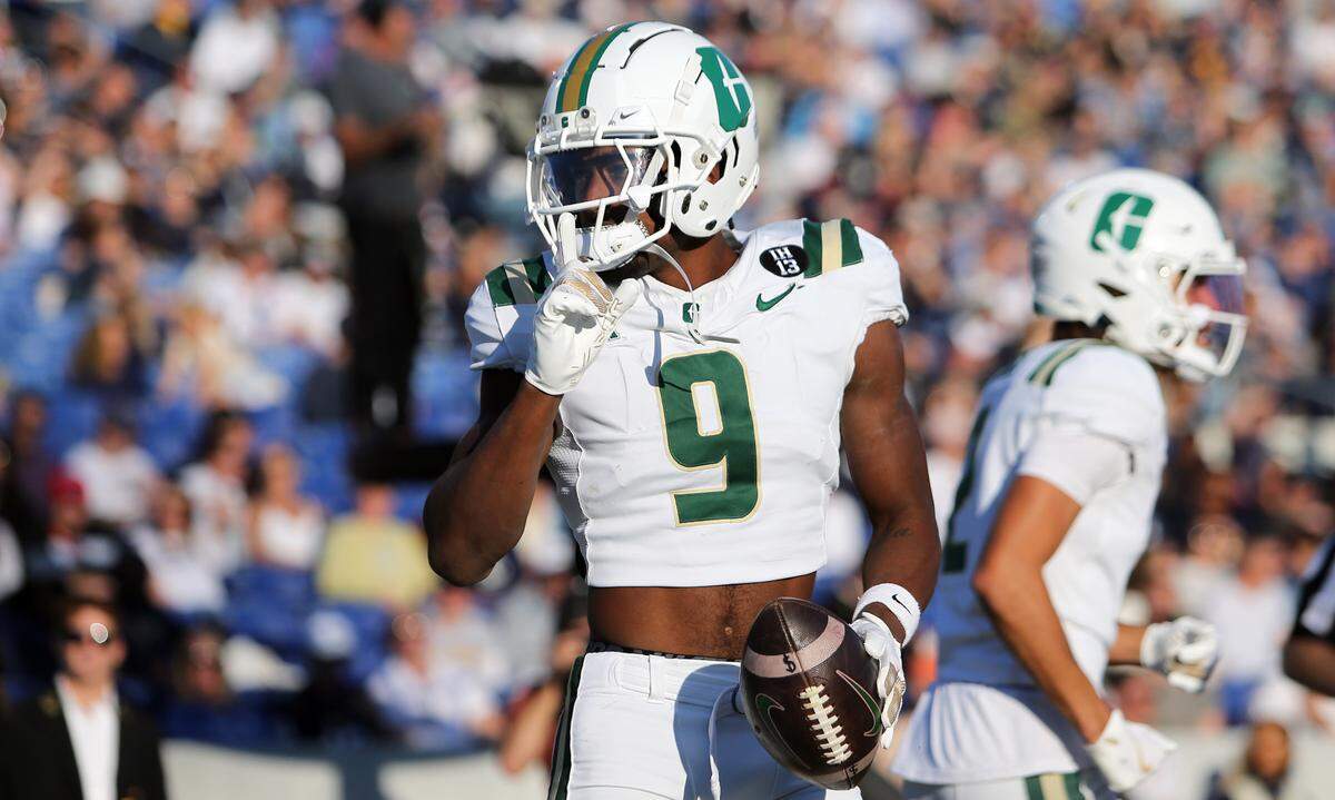 Oct 19, 2024; Annapolis, Maryland, USA; Charlotte 49ers wide receiver O’Mega Blake (9) celebrates after scoring a touchdown during the first half against the Navy Midshipmen at Navy-Marine Corps Memorial Stadium.