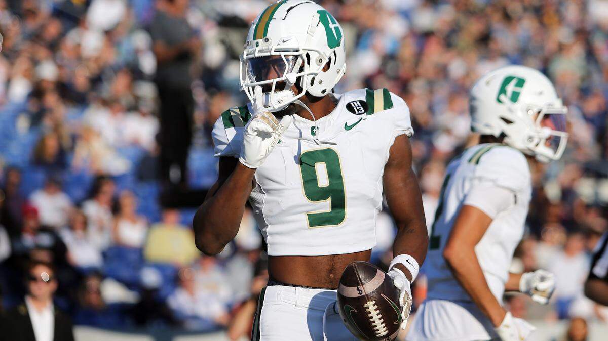 Oct 19, 2024; Annapolis, Maryland, USA; Charlotte 49ers wide receiver O’Mega Blake (9) celebrates after scoring a touchdown during the first half against the Navy Midshipmen at Navy-Marine Corps Memorial Stadium.