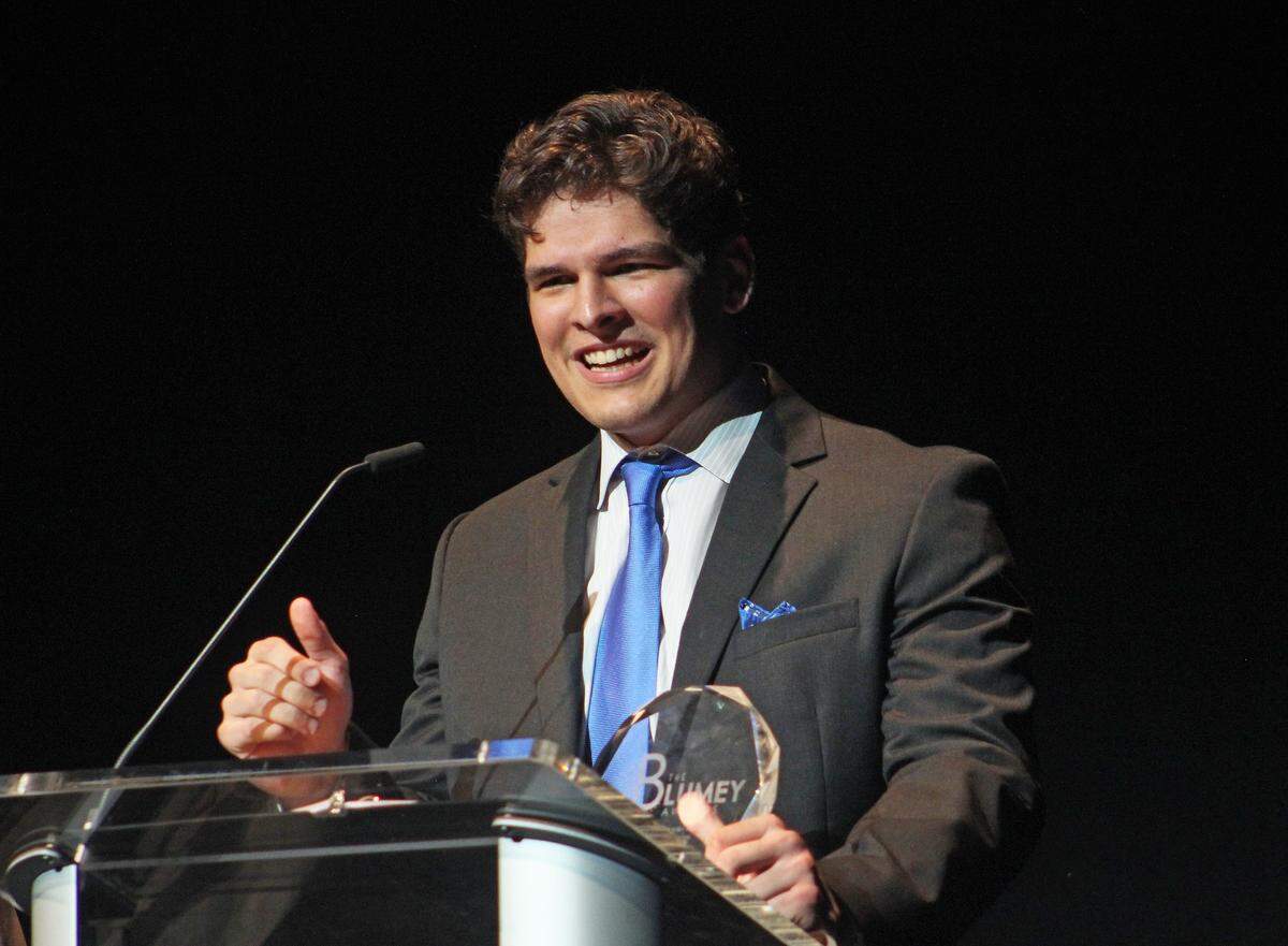 Josh Moraja accepting his award for Best Supporting Actor at the Blumey Awards in May.