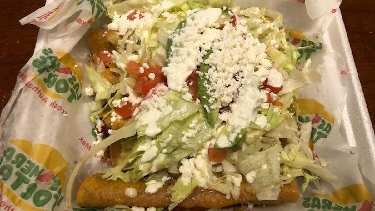 The flautas at Las Meras Tortas are topped with lettuce, tomato, avocado, jalapeños, guacamole, sour cream and cheese.