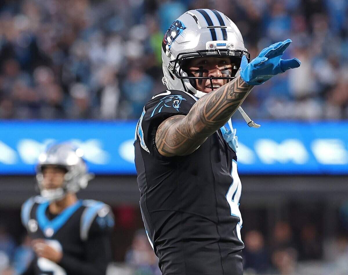 Carolina Panthers wide receiver Tetairoa McMillan motions for a first down following a pass reception from quarterback Bryce Young during action against the Los Angeles Rams at Bank of America Stadium on Saturday, January 10, 2026. The Rams defeated the Panthers 34-31.