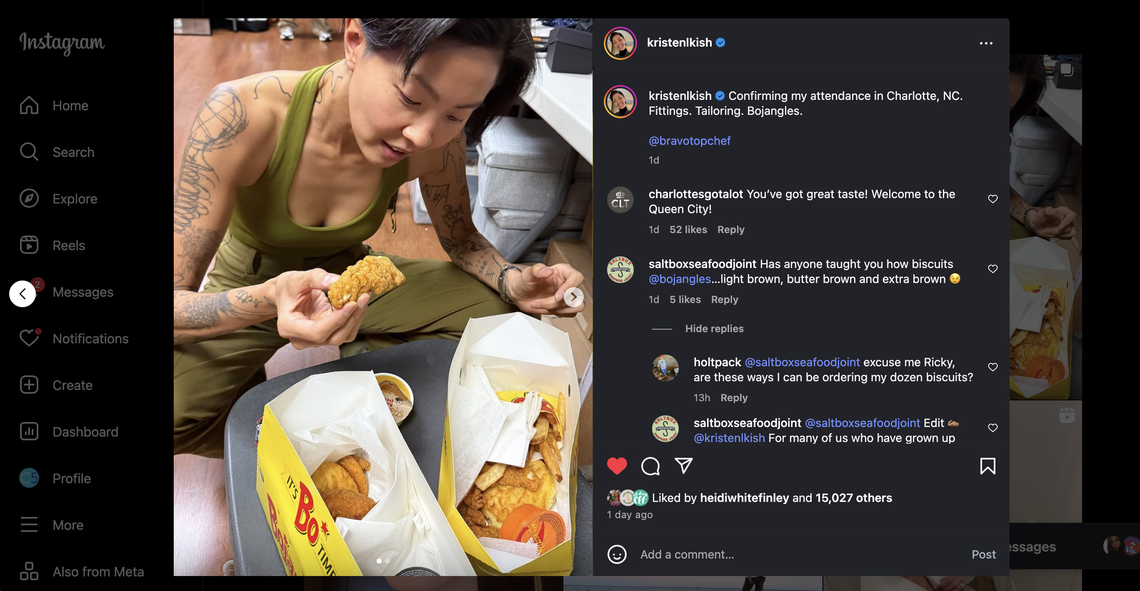 A screenshot of an Instagram post by the user kristenkish. The post shows a person with short, dark hair and tattoos on their arms, sitting and holding a piece of fried chicken. They are looking down at an open Bojangles’ paper bag filled with food. The caption reads “Confirming my attendance in Charlotte, NC. Fittings. Tailoring. Bojangles.” The comments below the post are also visible. The screenshot shows the Instagram interface around the image, including the search bar, navigation menu, and like/comment buttons.