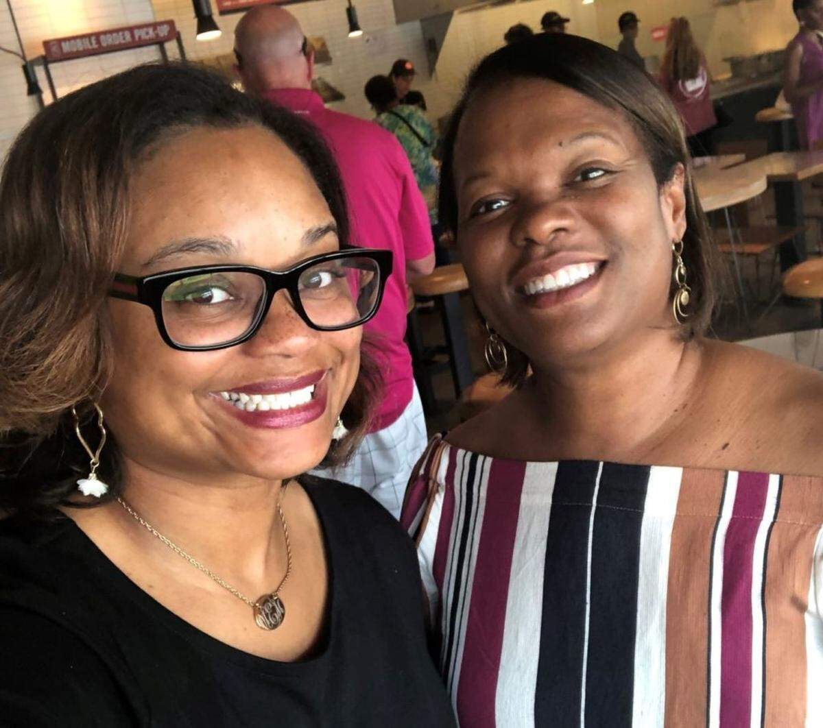 Charlitta Hatch, left, first met UNC Charlotte professor Debra Smith as a teenager interviewing for a job at the McCrorey YMCA.