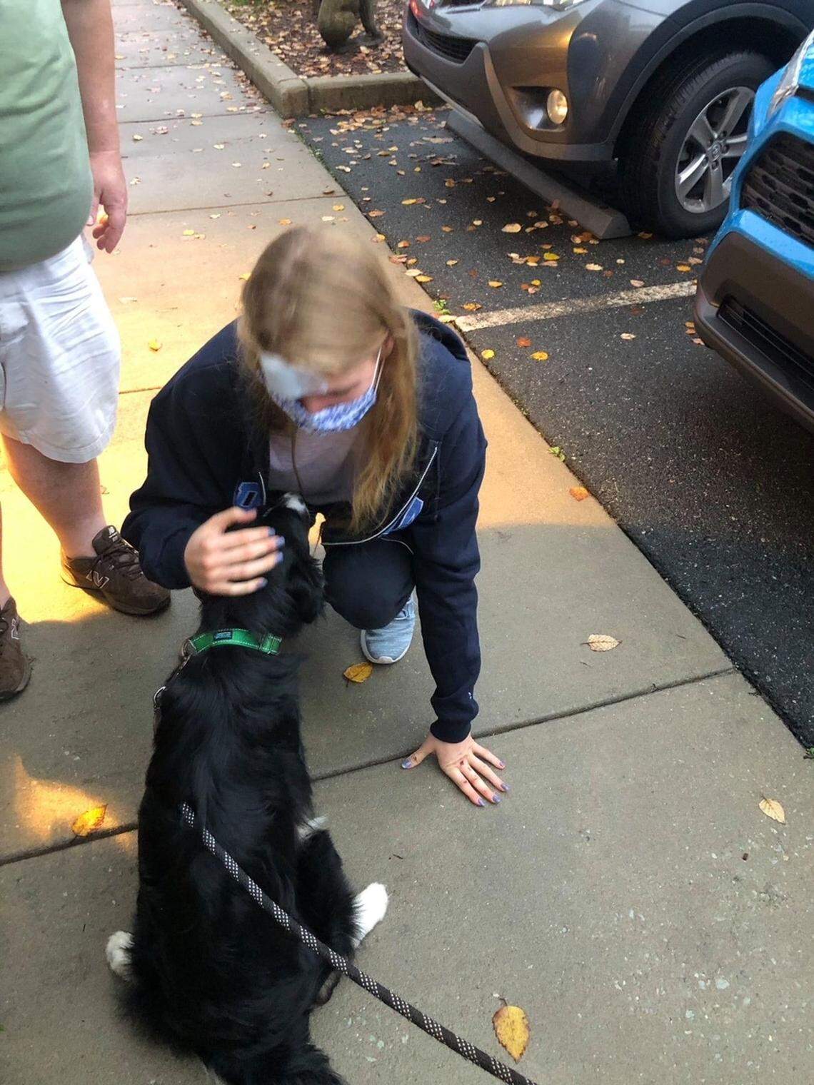 Sinclair Larson and Jasper reunite outside of Triangle Veterinary Referral Hospitals in Durham last Wednesday.